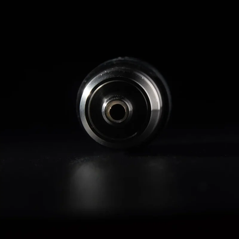 Puffco Peak Atomizer with WIIDZ 3D Chamber, displayed lying down, showcasing its unique design and features.