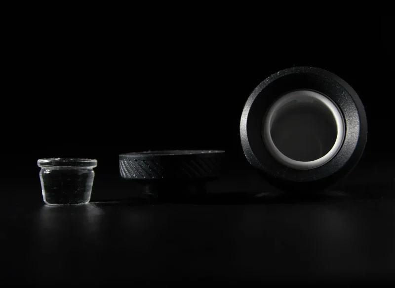 Puffco Peak Atomizer with WIIDZ 3D Chamber displayed horizontally, showcasing its unique design and features for enhanced dabbing experience.