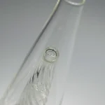 Close-up view of the Puffco Peak Glass Wiidz Original 2.0 with a clear center, showcasing its intricate design and high-quality craftsmanship.