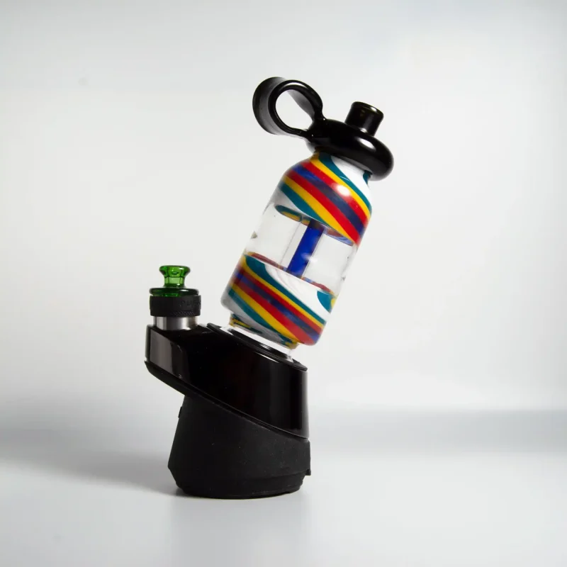 puffco peak pro glass attachment wiidz flask alt installed facing west.webp Puffco Peak Pro glass attachment installed on a Wiidz flask, oriented towards the west, showcasing the stylish and functional design for an enhanced smoking experience.