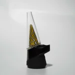 Puffco Peak Pro glass attachment by Wiidz featuring Ginger Man design, expertly installed and oriented facing west.