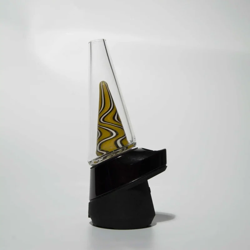 Puffco Peak Pro glass attachment by Wiidz featuring Ginger Man design, expertly installed and oriented facing west.