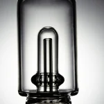 Close-up image of the Puffco Peak Pro glass attachment featuring Wiidz Tipsy in black with an inner tube design, highlighting its sleek and modern aesthetics.