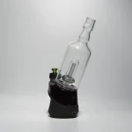 Puffco Peak Pro glass attachment with Wiidz Tipsy in black installed, oriented southeast against a clean white background.