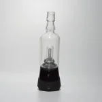 Puffco Peak Pro glass attachment with Wiidz Tipsy in black installed facing south, set against a clean white background, showcasing its sleek design and functionality.