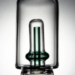 Close-up shot of Puffco Peak Pro glass attachment featuring Wiidz Tipsy green inner tube, highlighting its unique design and color for enhanced vaping experience.